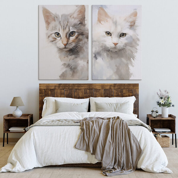 Two cats with their heads turned to the side